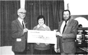 Pat Perry-Barton receiving her cheque (14K)